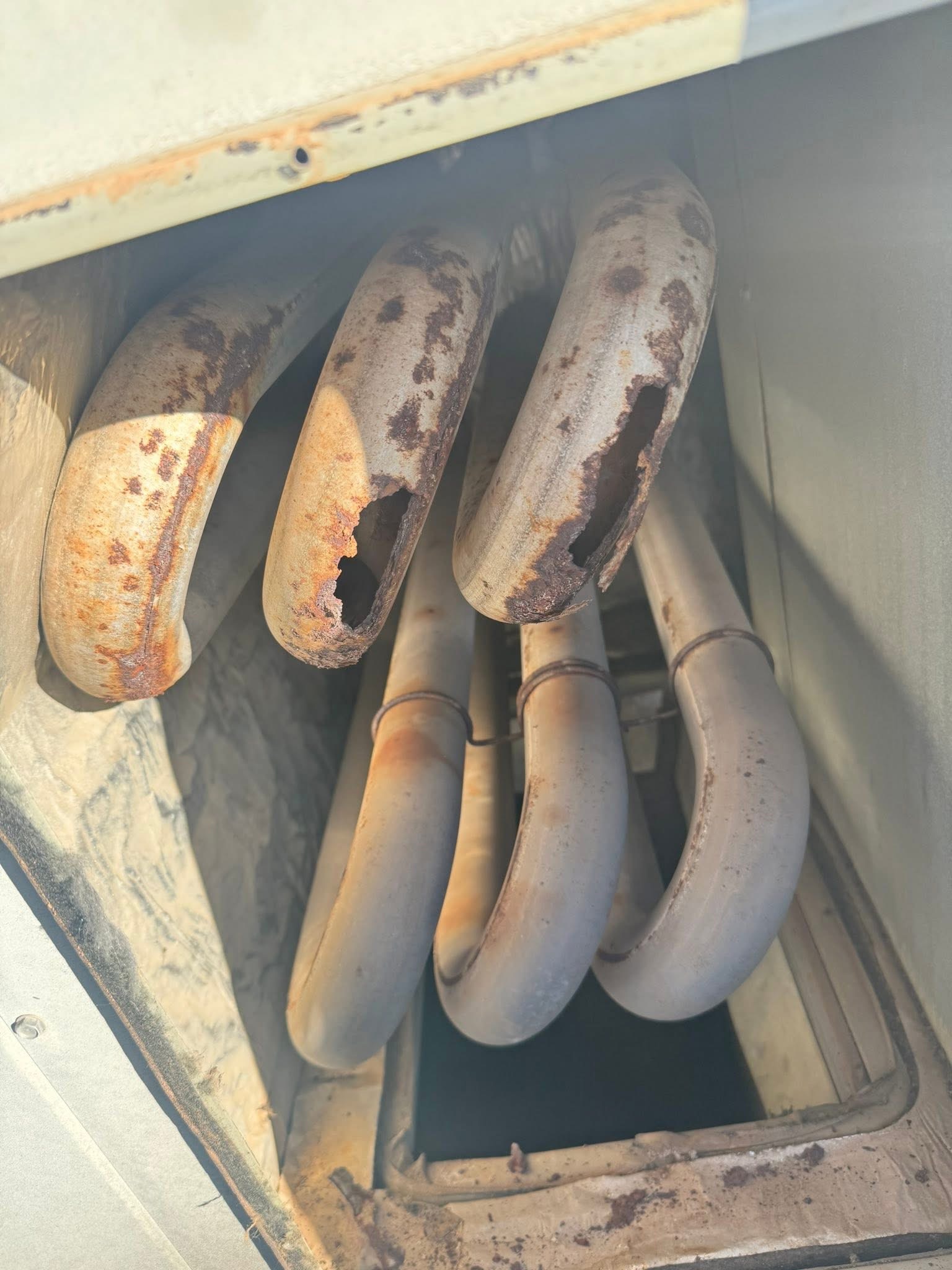 HVAC technician repairing refrigerant leak in Colleyville TX