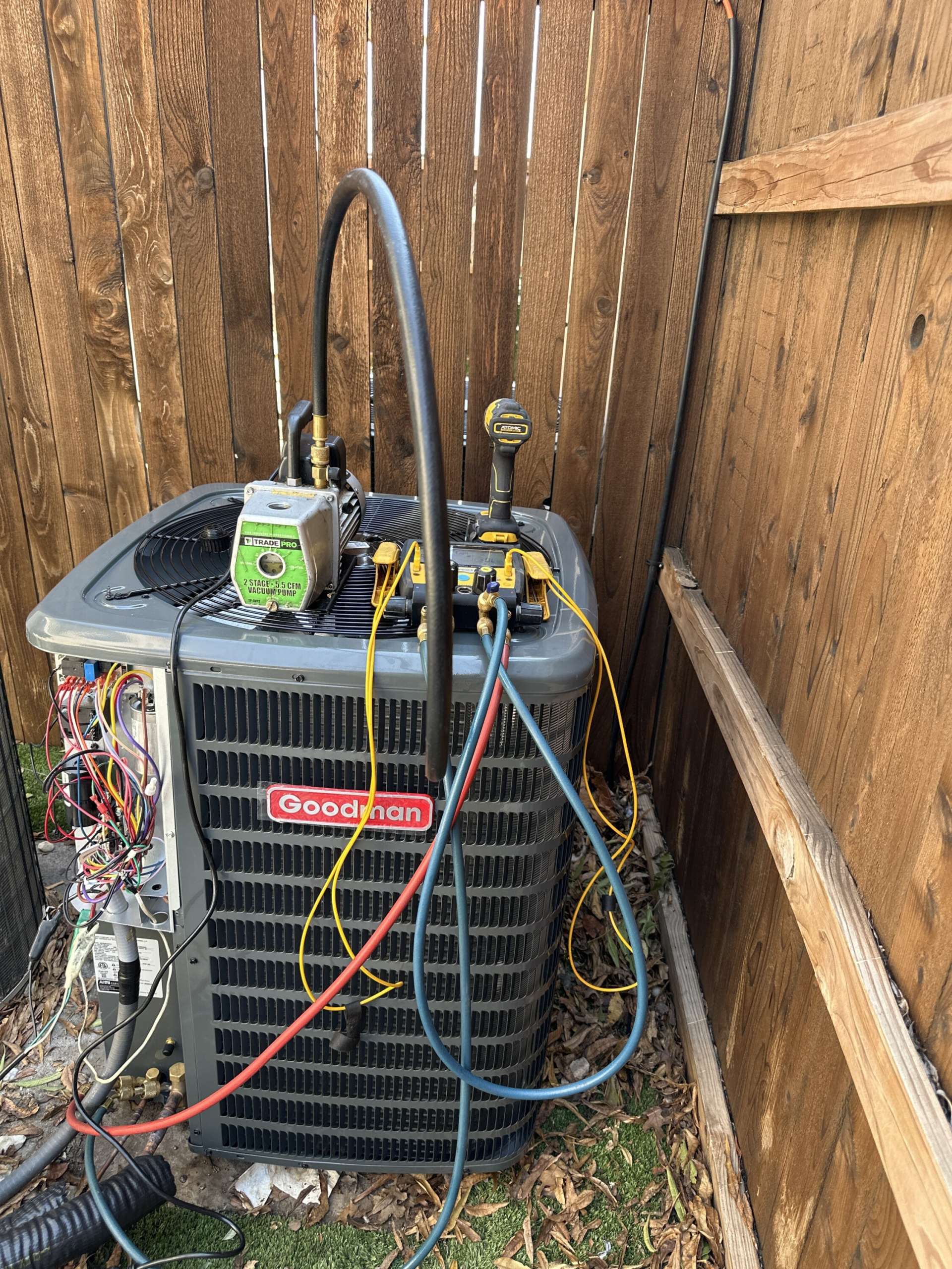 HVAC technician repairing refrigerant leak in Irving TX