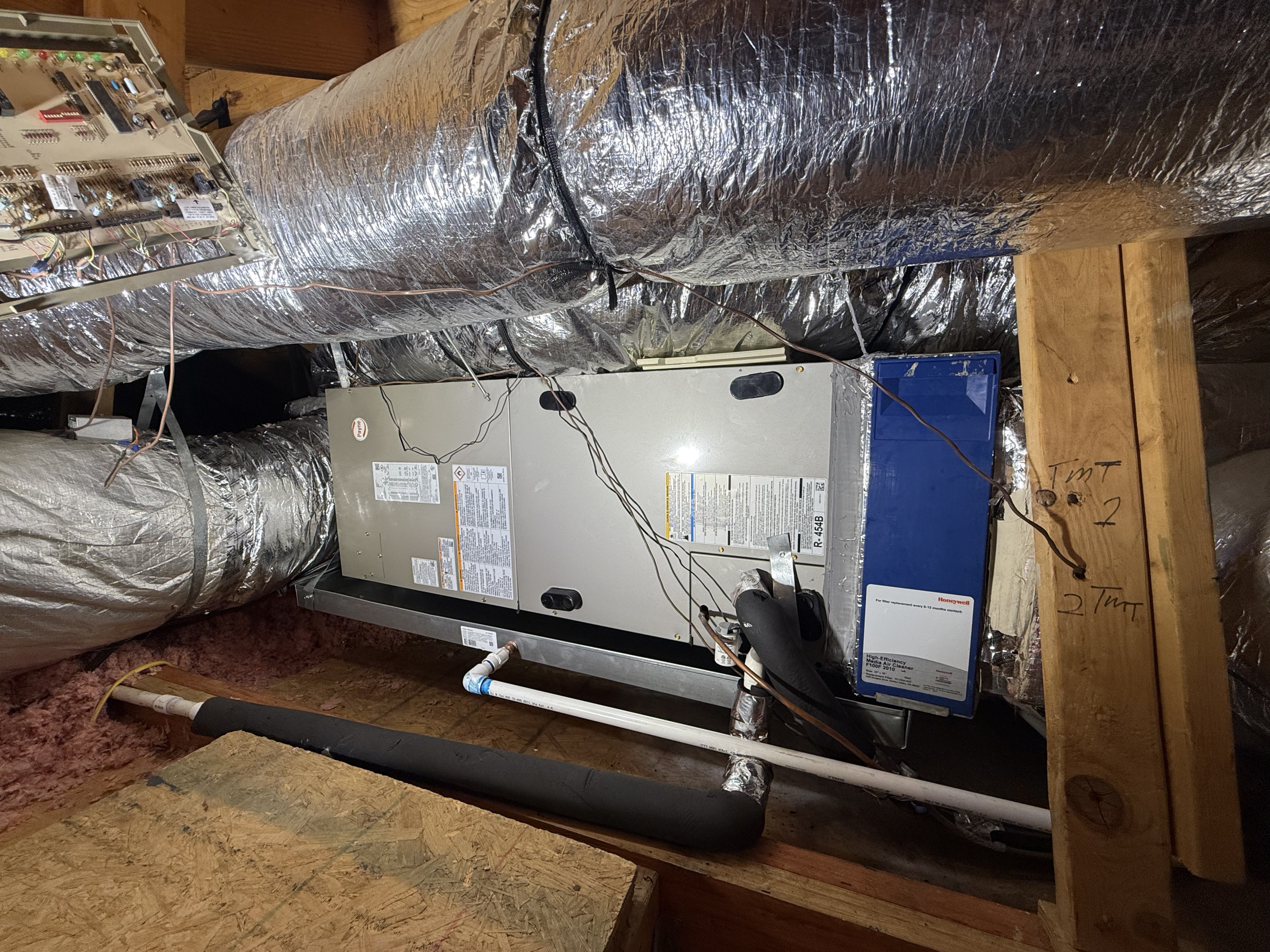 HVAC system in attic showing potential water leak risks from condensate lines in Fort Worth home